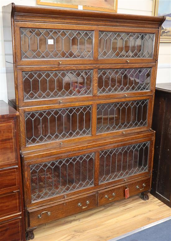 A four section Globe Wernicke style oak double bookcase W.129cm